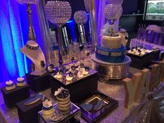 a table topped with lots of cakes and desserts