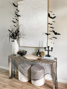 a console table with halloween decorations on it