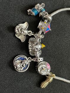 This is a handmade (hand put together) Disney's Dumbo Charm Bracelet! Disney Charm Bracelet, Pandora Charms Disney, Pandora Bracelet Designs, Pandora Pink, Crystal Bead Jewelry, Disneyland Outfits, Disney Charms, Pandora Disney, School Fit