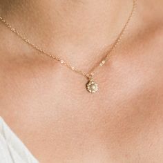 "Our dainty sunflower necklace is our newest addition to our dainty layering necklaces. Sunflowers symbolize adoration, loyalty, and longevity - making it the perfect gift for your loved ones. Available in gold filled or sterling silver. . . . . . . . . . . . . . . . . . . . . . . . . . . . . . . . . . . . . . . . . . . NECKLACE + Length: 16\" + 2\" extender + 14k gold filled -or- sterling silver sunflower 9mm pendant (hollow in back) + 14k gold filled -or- sterling silver spring clasp, jump rin Delicate Necklace With Flower Charm, Delicate Flower Pendant Jewelry With Flower Decoration, Minimalist Flower Necklaces For Bridesmaids, Delicate Necklace With Flower Charm And Round Pendant, Delicate Adjustable Necklace With Flower Charm, Delicate Flower Charm Necklace For Bridesmaids, Flower Charm Necklace For Bridesmaid Gift, Adjustable Flower Necklaces For Bridesmaid Gift, Adjustable Flower Necklace For Bridesmaid Gift