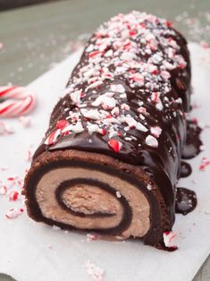 a chocolate roll covered in candy canes and sprinkles