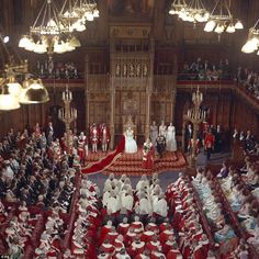 the royal wedding ceremony is being attended by many people in red and white outfits, all dressed