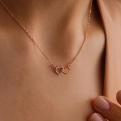 DOUBLE ∙ HEART ∙ NECKLACE  * Embrace love with this exquisite interlocking double heart necklace, a timeless piece for any occasion. Featuring two beautifully intertwined hearts, this dainty necklace symbolizes a deep connection and affection. Thoughtfully crafted, it's available in your choice of 14k gold, rose gold, or silver, allowing you to create a meaningful, personalized gift. Perfect for anniversaries, birthdays, Valentine's Day, or simply to show you care. Personalize this unique design to celebrate a special bond or cherished memory. * Each item in this listing is made from premium SOLID 925 Sterling Silver, ensuring lasting quality and shine. * Finish: 14K Gold ∙ Rose Gold ∙ Sterling Silver * Each piece is crafted just for you, making it a truly one-of-a-kind creation with a per Gold Necklace For Girlfriend, Necklaces For Girlfriend, Couples Necklace, Intertwined Hearts, Cute Necklaces, Astoria Ny, Double Heart Necklace, Necklace For Girlfriend