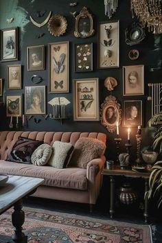 a living room filled with furniture and lots of pictures on the wall next to a coffee table