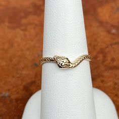 14KT yellow gold snake wave band ring with diamond eyes. Size 7 May be doable in other sizes Weight: 2.22 grams Band width: 2.1mm Solid 14k gold (2) diamonds; 1 on each eye Genuine diamonds 14k Gold Snake-shaped Ring, Yellow Gold Snake-shaped 14k Gold Rings, 14k Gold Snake Shape Ring For Anniversary, 14k Gold Snake Ring For Anniversary, 14k Gold Snake Jewelry For Anniversary, Adjustable 14k Gold Snake Ring For Anniversary, Adjustable Fine Jewelry Snake Ring For Anniversary, Gold Snake-shaped 14k Ring, 14k Gold Snake Shaped Ring