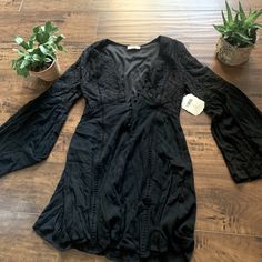 This Is Such A Cute Dress. It Has Witchy Vibes And Would Be So Cute Paired With The Right Boots! Black V-neck Boho Dress For Spring, Black Mini Dress For Beach In Fall, Black Fall Vacation Dresses, Casual Black Boho Dress With V-neck, Casual Black V-neck Boho Dress, Bohemian V-neck Dress For Night Out, Black Boho Dress For Spring Vacation, Spring Black Boho Beach Dress, Spring Boho Beach Dress In Black