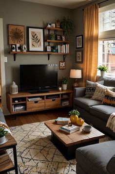 a living room filled with furniture and a flat screen tv on top of a wooden table