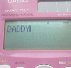 a pink digital calculator with the word daddy written on it's display