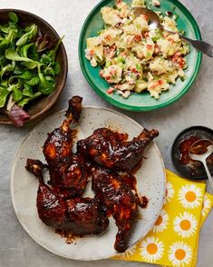 the meal is prepared and ready to be eaten on the table, including chicken wings