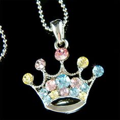 "PERFECT CHRISTMAS GIFT FOR LADIES You are getting a Princess / Queen Crown Pendant with Swarovski crystals. It comes with a FREE 16\" Original Rhodium Plated Snake Chain necklace with lobster clasp. Crown size is 15/16\" (2.2cm) wide X 1\" (2.5cm) high. Crystal Color: Aqua + Light Sapphire Prices are in US$. For shipping policies and other important information, click on \"profile\" on the right. See an item that you like but has already been sold? Contact me to see if I have more! Thank you fo Silver Necklace With Bling For Birthday, Sparkling Silver Necklace For Birthday, Crown Shaped Rhinestone Jewelry For Gifts, Gift Charm Necklaces With Rhinestones, Crystal Crown Jewelry For Gifts, Multicolor Rhinestone Crystal Necklace As Gift, Jewelry Best Friends, Rainbow Crown, Best Friends Christmas