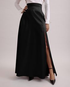 JOYCE est une jupe longue en satin noir avec une fente haute ouverte et une fermeture cachée. Avec son élégance, cette jupe sera votre parfait allié pour votre prochain événement! Fitted Skirt With Split Design, Elegant Party Skirt With Side Slits, Fitted Long Skirt With Side Slits, Formal Skirt With Side Slits, Elegant Full Length Lined Pencil Skirt, Formal Long Skirt With Side Slits, Classic Long Skirt Bottoms For Evening, Fitted Bottoms With Long Inseam For Evening, Fitted Long Maxi Skirt With Side Slits