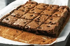 a close up of a brownie on a piece of paper