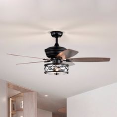 a ceiling fan in a room with white walls