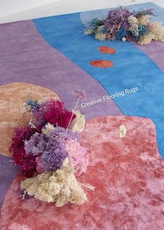 flowers are placed on the rugs in front of each other