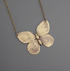 "Vintage Necklace - Butterfly Necklace - Brass Necklace - Butterfly Jewelry - Statement Necklace - handmade jewelry This is such a fabulous vintage brass necklace!  A lovely large butterfly.  Great detail with a beautiful patina.  The pendant hangs from a delicate vintage brass ladder chain. Chloe says, \"Wear it and feel fabulous!\" This pendant is 2\" wide.  Thanks for visiting Chloe's" Vintage Handmade Butterfly Necklace, Gold Nickel-free Butterfly Necklace, Vintage Brass Jewelry For Crafting, Nickel Free Gold Butterfly Necklace, Vintage Bronze Jewelry For Crafting, Handmade Gold Butterfly Necklace, Handmade Gold Bohemian Butterfly Necklace, Butterfly Charm Brass Jewelry Gift, Brass Jewelry With Butterfly Charm For Gift