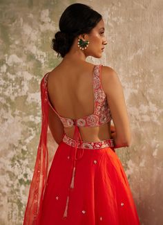 Unveil your inner elegance with the exquisite Red Embroidered Silk Organza Lehenga Set, a perfect blend of tradition and modernity. Crafted from pure silk organza, this ensemble features a red lehenga that exudes opulence through its all-over handwork motifs, adding a touch of luxury to every twirl. Paired with a delicately embroidered blouse, meticulously crafted with intricate aari handwork that showcases timeless artistry, the look is completed with a dupatta adorned with a heavily hand-embroidered border and motifs, elevating the ensemble to a new level of elegance. Perfect for a bride or bride-to-be on your special day, this outfit promises to make you the center of attention with its vibrant hue and breathtaking design. Composition : Dupatta & Lehenga - Pure Silk Organza, Blouse - Me Red Sleeveless Lehenga For Weddings, Sleeveless Red Lehenga For Wedding, Red Lehenga For Wedding, Red Sleeveless Traditional Wear For Wedding, Elegant Red Anarkali Set With Unstitched Blouse, Elegant Dresses For Diwali Ceremony, Fitted Choli With Intricate Embroidery For Ceremonies, Red Embroidered Lehenga For Ceremony, Fitted Sharara With Resham Embroidery For Ceremony