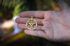 Tree of Life necklace. This pendant has a diameter of 1,2 inches (3 cm) and is crafted by hand in 18k gold. This pendant is a one of a kind design of the 'Tree of Life' symbol. The Tree of Life is an ancient symbol, that has been found in sacred temples all over the world. About the Tree of Life symbol: The Tree of Life is an ancient symbol that has been used all over the world, as a symbol of thriving, harmony, creation and fertility. This one of a kind symbol was designed and created as an ins Chakra Stones Jewelry, Sacred Geometry Jewelry, Geometry Jewelry, Tree Of Life Symbol, Necklace Tree, Celtic Tree, Gold Tree, Life Symbol, Golden Jewelry