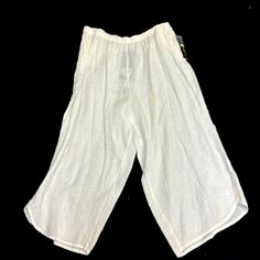 Plus Size Linen Cropped Pants By Ic By Connie K. Elastic Waistband, Side Pockets. Nor Stark White, More Of An Ivory Color. 3 Button Detail At Hemline Of Pant Legs.#72493 Casual Capri Length Pants For Beach, Casual Beach Capri Pants, Capri Length Pants With Pockets For Vacation, Casual Capri Length Pants For Vacation, Casual Capri Pants For Vacation, Vacation Capri Bottoms With Pockets, Beach Capris With Pockets, Casual Capri Length Bottoms For Vacation, Cotton Bottoms With Button Closure For Daywear