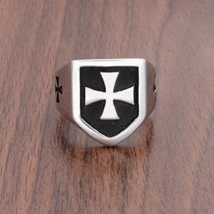 Presenting this Knights Templar Commandery Ring in durable stainless steel, showcasing a bold black and silver design. This emblematic ring symbolizes the strength and heritage of the esteemed order, a striking statement of commitment and honor. Metals Type: Stainless Steel Surface Width: 20mm Ring Face: 1.9cm*1.64cm Weight: 13g We ship worldwide to 185 countries! Please allow 1-2 business weeks for your order to arrive. Iron Cross Ring, Silver Knight, Iron Cross, Steel Gifts, Silver Design, German Army, Cross Ring, Bold Black, Black And Silver