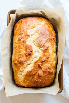 a loaf of bread sitting in a brown box