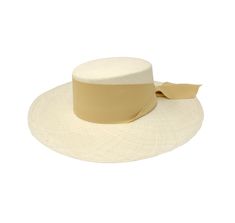 Long Brim Cordovan Hat With Maxi Bow The Panama Hat, also known as Montecristi Hat is a traditional Ecuadorian model made with 100% Toquilla Straw, a natural fiber known for its quality and beauty. The perfect beach-to-city accessory, elegant, yet fresh and versatile for original matches with different kinds of fashion. -We ship with DHL Express. Shipping takes approximately 3 to 5 days to arrive depending on the destination. -Need Help? Please contact: customercare@sensistudio.com -All Sales Ar Beige Woven Straw Hat With Curved Brim, Handmade Brimmed Boater Hat In Toquilla Straw, Handwoven Natural Hat Band With Flat Brim, Handmade Toquilla Straw Boater Hat, Natural Toquilla Straw Hat With Flat Crown, Woven Beige Brimmed Hat, Beige Woven Brimmed Hat, Kentucky Derby Woven Flat Brim Panama Hat, Bohemian Cream Panama Hat With Curved Brim