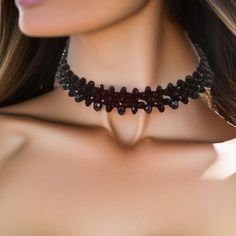 This Black Crystal Choker is a exquisite accessory is a fusion of elegance and mystique, designed to adorn your neckline with a touch of dark sophistication. Crafted meticulously, the choker comprises two layers of meticulously arranged black crystal rondelles, each 4mm and 6mm in size. These crystals have been carefully selected to create a mesmerizing play of light and shadows, ensuring that the choker sparkles with every subtle movement you make. The moment you shift, the choker comes alive w Edgy Black Choker For Festivals, Edgy Halloween Party Jewelry, Edgy Halloween Party Choker, Gothic Black Beads Jewelry For Halloween, Gothic Black Beads Halloween Jewelry, Black Beaded Jewelry For Halloween, Handmade Punk Black Choker, Handmade Black Punk Choker, Halloween Beaded Black Jewelry