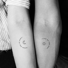 two people with matching tattoos on their arms