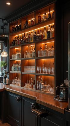 a bar with lots of bottles and glasses on it