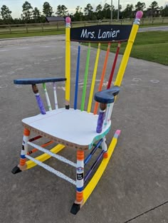 a chair made out of crayons with a ruler on the back and arms