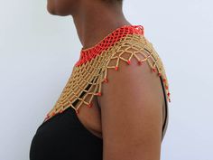 AMAZI Beaded cape necklace made using 100% fine beads.

Color: Red and Gold

Closure: hook

Length: 16 inches long

Material: Beads

It is made on order hence it's ready to ship within 1-3 days.

Shipping cost is calculated during checkout.

DHL Express shipping that takes  3-5 days to be delivered Elegant Festival Beaded Necklaces With Gold Beads, Elegant Gold Beaded Festival Necklaces, Elegant Beaded Choker Necklaces For Festival, Elegant Bib Necklace With Round Beads For Festivals, Elegant Bead Cap Necklaces For Festivals, Elegant Large Beads Bib Necklace For Festivals, Elegant Necklace With Bead Caps For Festivals, Elegant Large Bead Choker For Festivals, Elegant Festival Necklace With Bead Caps