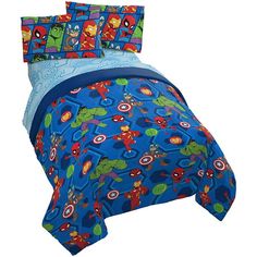 the bedding is blue and has cartoon characters on it, as well as spider - man