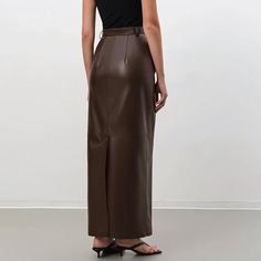 Discover Timeless Elegance and Comfort Embrace the perfect blend of style and comfort with our Vintage Brown Faux Leather Skirt, designed for the modern woman. Crafted with meticulous attention to detail, this ankle-length skirt is a testament to sophistication and versatility, making it an essential addition to your autumn/winter wardrobe. Exceptional Design and Quality Made from a luxurious combination of polyester, spandex, and viscose, this skirt offers a premium leather look without comprom Split Skirt Pattern, Fashion Outfits Autumn, Pu Skirt, High Waist Long Skirt, Pu Leather Skirt, Ankle Length Skirt, Unique Outfit, Split Skirt, Long Skirts For Women