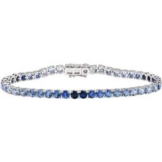 Indulge in the calming beauty of the sea with the A Sea of Blue Ombre Bracelet from RUCHI New York. This stunning tennis bracelet features 9.66 carats of captivating blue sapphires, each with its own unique shade of dreamy blue, from cerulean to cobalt. The ombre effect of the stones creates a mesmerizing gradient that reflects the changing hues of the ocean. With its 18k white gold setting and box clasp closure, this bracelet is the perfect addition to any jewelry collection. Wear it alone for Luxury Blue Diamond Bracelet With Brilliant Cut, Blue Diamond Bracelet With Brilliant Cut Luxury Style, Luxury Sapphire Gemstone Tennis Bracelet, Blue Tanzanite Gemstone Bracelets, Blue Sapphire Diamond Round Bracelet, Sapphire Tennis Bracelet With Jubilee Design, Blue Brilliant Cut Diamond Bracelet, Elegant Blue Bracelet With Brilliant Cut, Blue Diamond Bracelet With Brilliant Cut