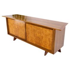 an art deco sideboard with glass top