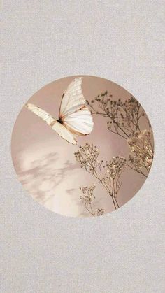 a white butterfly flying in the sky over some plants and flowers on a light gray background