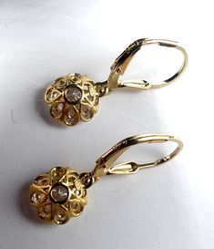 "Brand new marked 925 gold plated sterling silver & CZ drop earrings, In very good condition. It's 1\" long. Cz 9 mm across. Weighs 2.7 gram. Thanks." Classic Gold Diamond Drop Earrings, Gold Diamond Pierced Earrings For Formal Occasions, Dainty Cubic Zirconia Earrings For Formal Occasions, Dainty Yellow Gold Diamond Earrings For Formal Events, Dainty Yellow Gold Diamond Earrings For Formal Occasions, Classic Gold-plated Diamond Earrings, Gold Plated Lever Back Earrings For Anniversary, Gold Cubic Zirconia Earrings For Anniversary, Gold Teardrop Diamond Earrings For Anniversary