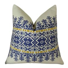 a blue and white pillow with yellow trimmings on the front, sitting on a white background