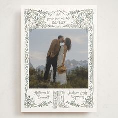 a wedding card with an image of a bride and groom kissing