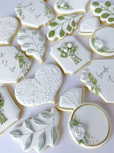 many decorated cookies are arranged on a table