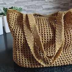 a crocheted purse sitting on top of a table