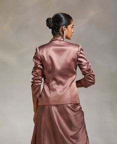 Editor's Note Style a traditional look with a solid lapel jacket with hand embroidery detailing Note: Blouse and skirt worn by model is for styling purposes only. Color: Mauve Fabric: Heavy Satin Fit type: Tailored Components: Jacket Occasion: Party Care: Dry Clean Only About the Designer The crux and essence of the label, Divya Aggarwal, is to challenge and revamp the face of ordinary traditional wear while being customer oriented. Driven by the values of individuality and creativity, this cont Formal Long Sleeve Sets With Hidden Button Closure, Evening Long Sleeve Fitted Set, Fitted Long Sleeve Evening Set, Evening Sets With Fitted Long Sleeve, Long Sleeve Single Breasted Wedding Sets, Silk Notch Lapel Outerwear For Wedding, Silk Wedding Outerwear With Notch Lapel, Semi-formal Fall Sets With Lapel Collar, Fitted Long Sleeve Sets For Semi-formal Occasions