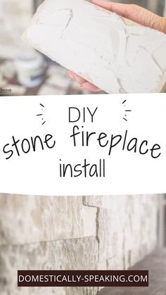 someone holding up a sign that says diy stone fireplace install