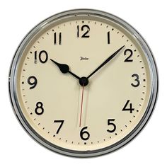 an analog clock with black hands and numbers on the face is shown against a white background