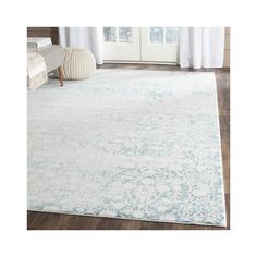 a white and blue rug in a living room