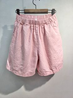 "Women's Organic Linen Cotton Water Color Tone Soft Daily Shorts for Summer Natural Loose fit Banding waist and mid waist Size One size, good for US 4-12 with loose fit Length 41cm / 17\" Waist width 30cm /12\" Inseam 18cm /7\" Fabric and Care Organic Linen 60% Organic Cotton 40% Machine washable and tumble dry Made in S Korea" Pink Cotton Bottoms With Elastic Waistband, Pink Cotton Bottoms Solid Color, Pink Cotton Bottoms, Pink Cotton Short Length Pants, Solid Color Summer Loungewear Bottoms, Casual Pink Bottoms For Spring, Casual Pink Bottoms With Pockets, Relaxed Fit Solid Pink Bottoms, Summer Baggy Shorts With Elastic Waistband