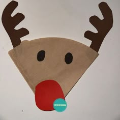 a reindeer hat made out of burlocked material with a red nose and antlers on it