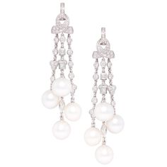 The diamond and pearl chandelier earrings feature a cascade with 8 South Sea pearls of 11mm diameter. The untreated South Sea pearls originate from the waters of Northwestern Australia. They display a beautiful nacre and their natural color and high luster have not been enhanced in any way. The design is complete with 4.94 carat of diamonds of different cuts (round, marquise, square) of top quality (color, clarity and cut, F-G/VVS). The earrings are one-of-a-kind and entirely handmade in 18 cara Tassel Chandelier, Pearl Chandelier Earrings, Diamond Chandelier Earrings, Fine Pearl Jewelry, Pearl Chandelier, Earrings Diamonds, Gold Chandelier Earrings, Earrings Chandelier, Antique Chandelier