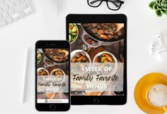 an ipad and tablet sitting next to each other on top of a white table with food