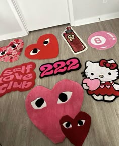 hello kitty rugs are laid out on the floor next to each other with eyes and hearts