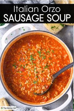 A pot of Italian orzo sausage soup with a rich tomato base, garnished with herbs. A ladle rests in the pot, and slices of bread are visible at the top. The text at the top reads: Italian Orzo Sausage Soup.